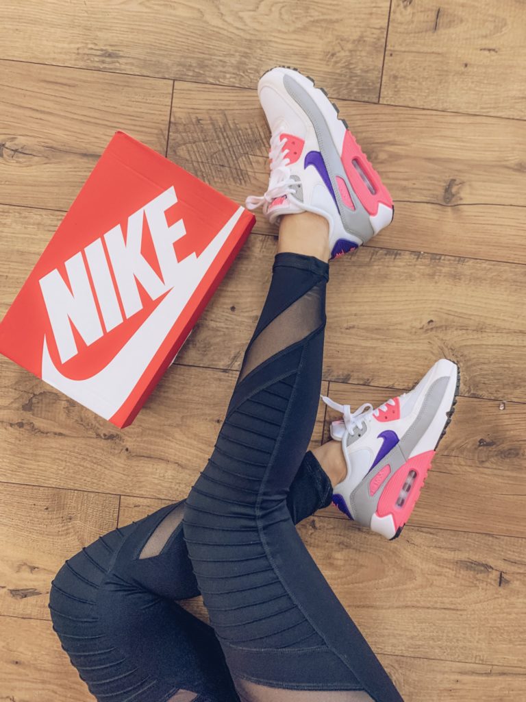 moto leggings and Nike sneakers