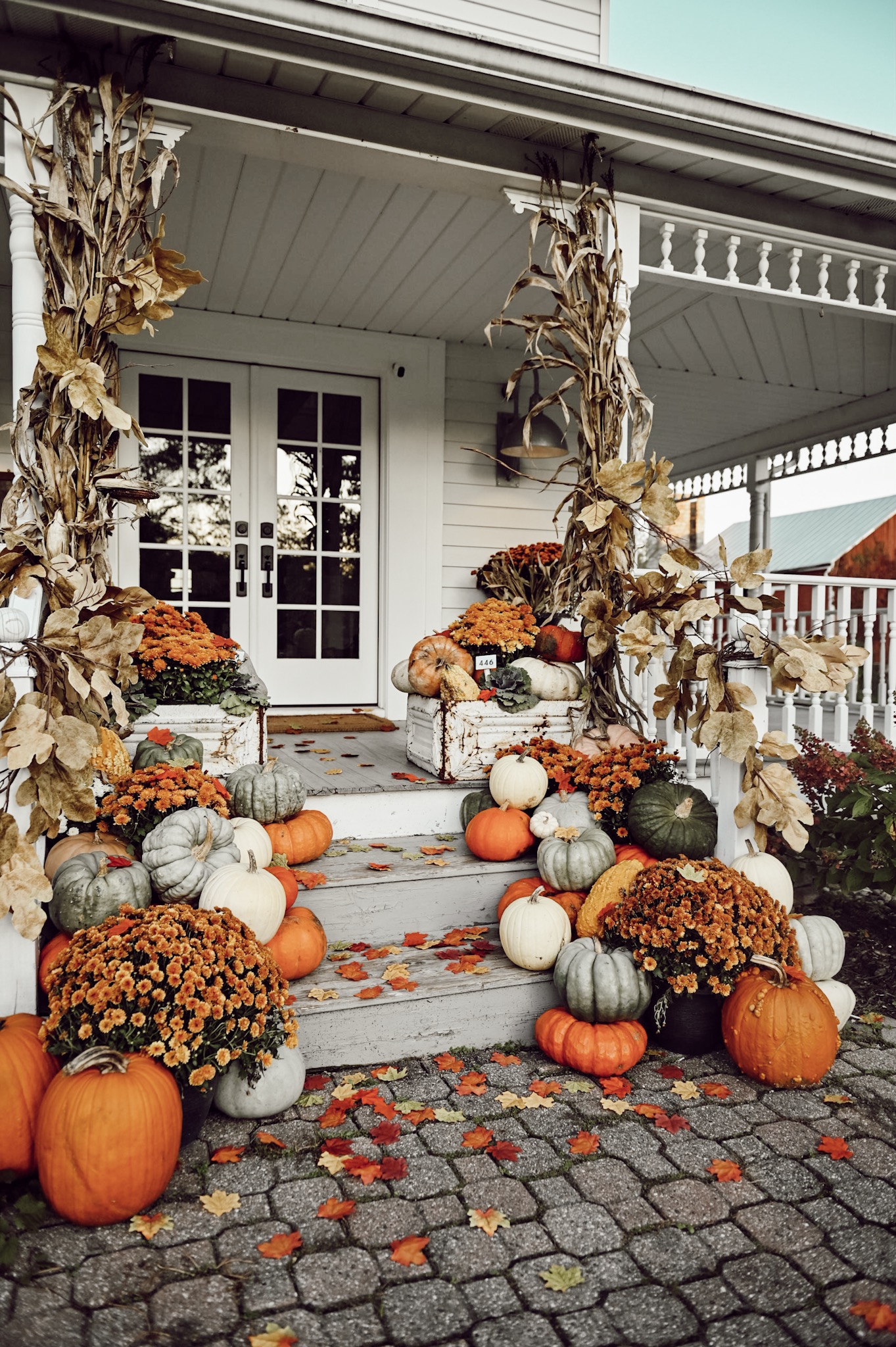 front porch with pumpkins